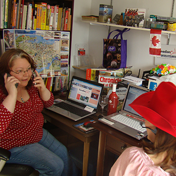Annie and Pam juggling tasks in our busy little office back in 2010
