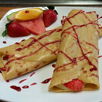 Fruit and custard-filled crepes at Resto Bar Le Blues, Baie-Comeau, Québec